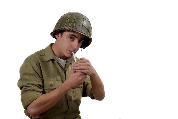 American soldier lights a cigarette Stock Picture