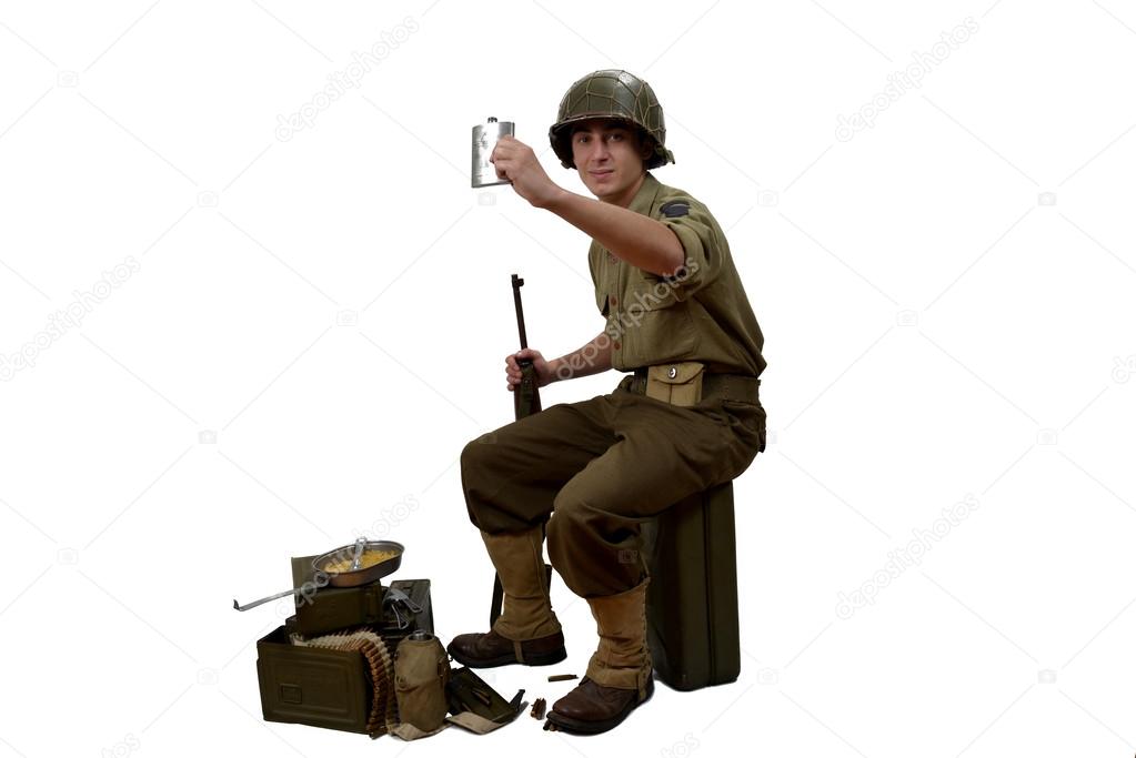 young American soldier takes a sip of alcohol