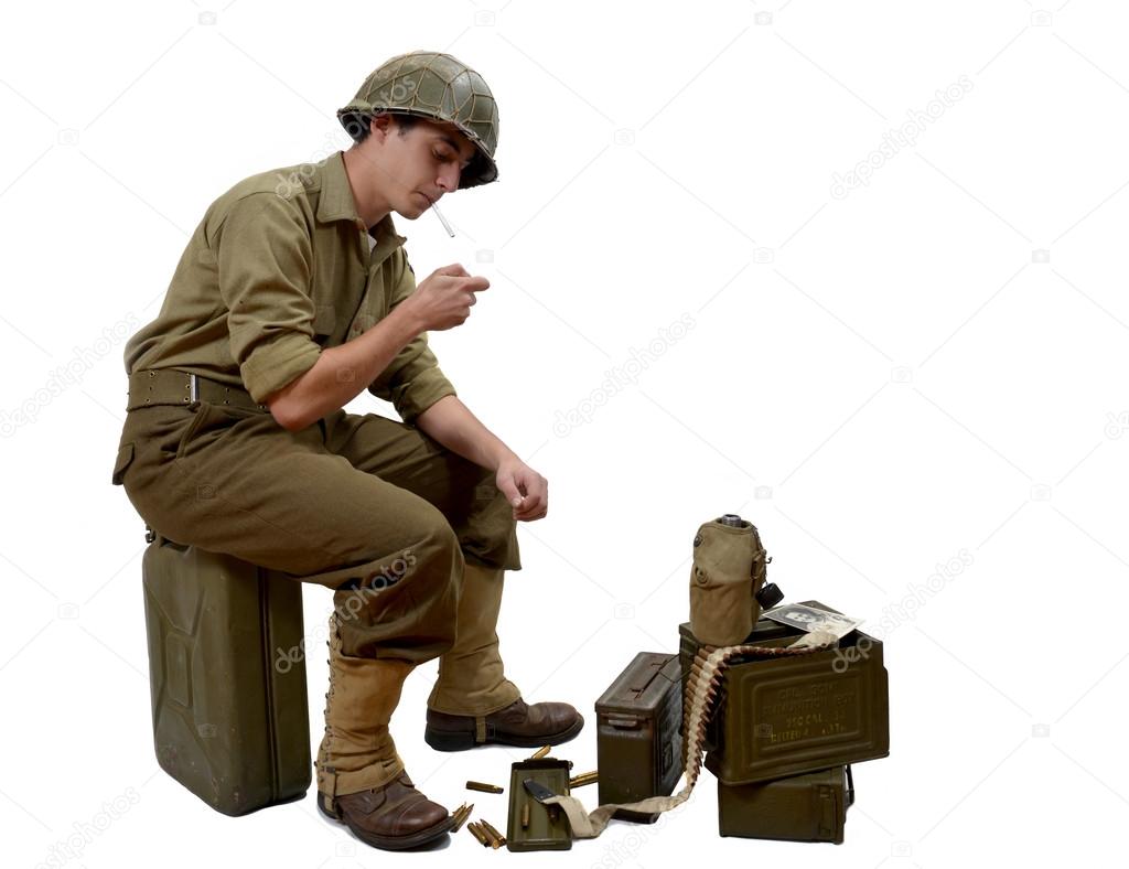 young American soldier light a cigarette