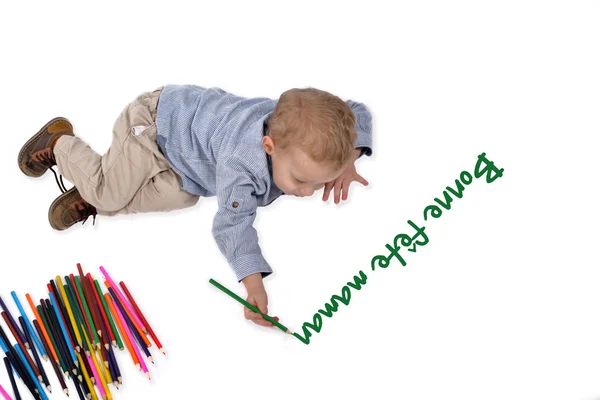 Bebê desenha com lápis de cera bonne fetes mamão — Fotografia de Stock