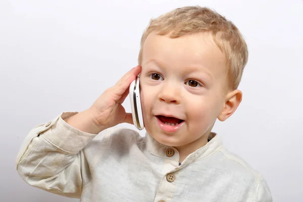 Baby with a mobile phone Stock Photo