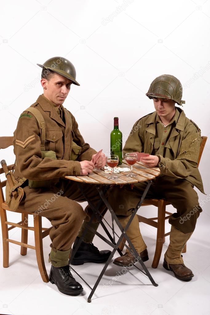 an English soldier and an American soldier playing cards