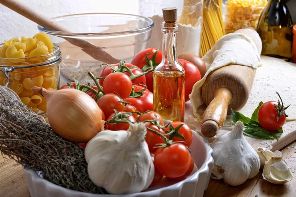 Pizza dough and ingredients — Stock Photo, Image