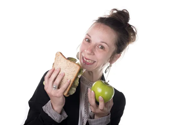 Choix difficile entre gâteau et pomme — Photo