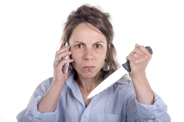 Young woman with knife and phone — Stock Photo, Image