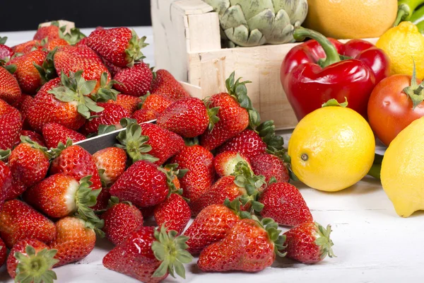 Strawberries with some fruits and vegetables — Stock Photo, Image
