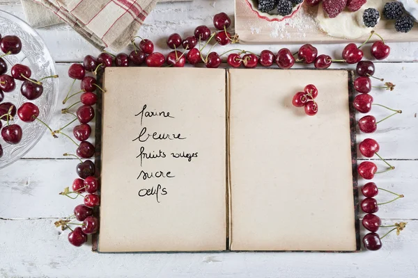 Cookbook with ingredients — Stock Photo, Image