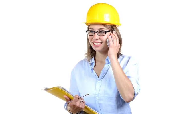 Joven arquitecta con un casco amarillo — Foto de Stock