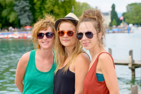 Three young women make tourism in Annecy — Stock Photo, Image