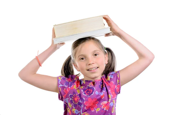 Μαθήτρια με βιβλία στο κεφάλι της — Φωτογραφία Αρχείου