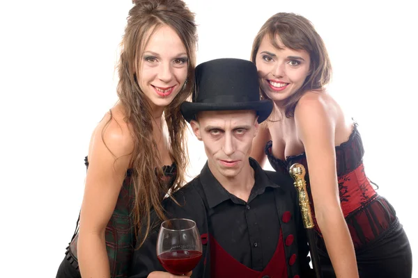 Two women and a man in disguise halloween — Stock Photo, Image