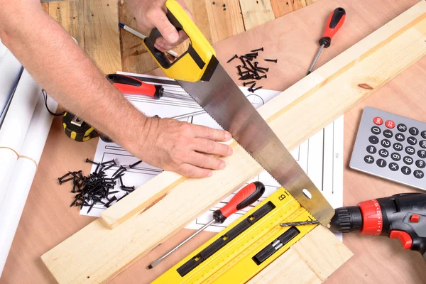 A man made a piece of furniture with various carpentry tools — Stock Photo, Image