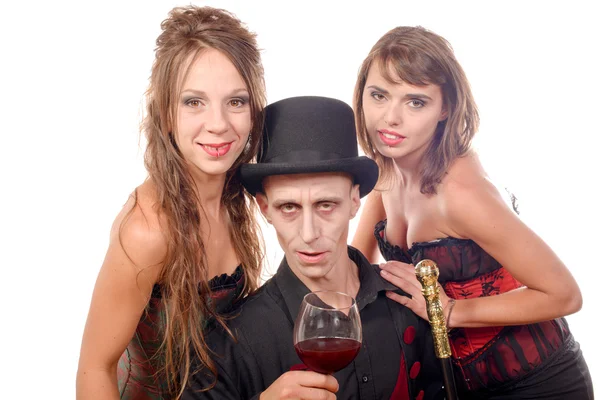Two women and a man in disguise vampire — Stock Photo, Image