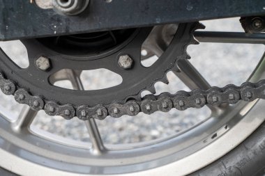 the detail of a motorcycle rear chain.