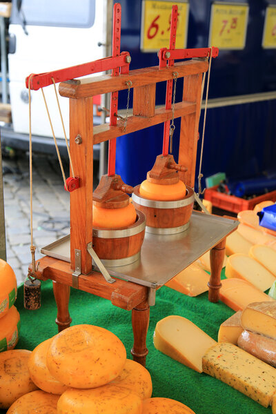 Dutch Gouda cheese on the cheese market in August of food news on the street in the Netherlands