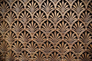 background decorative brass openwork lattice on the floor in the interior with a beautiful floral ornament clipart