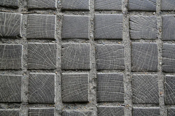 003 Hintergrund alte abgenutzte Holzpflaster von Plätzen auf der Straße vor dem Haus — Stockfoto