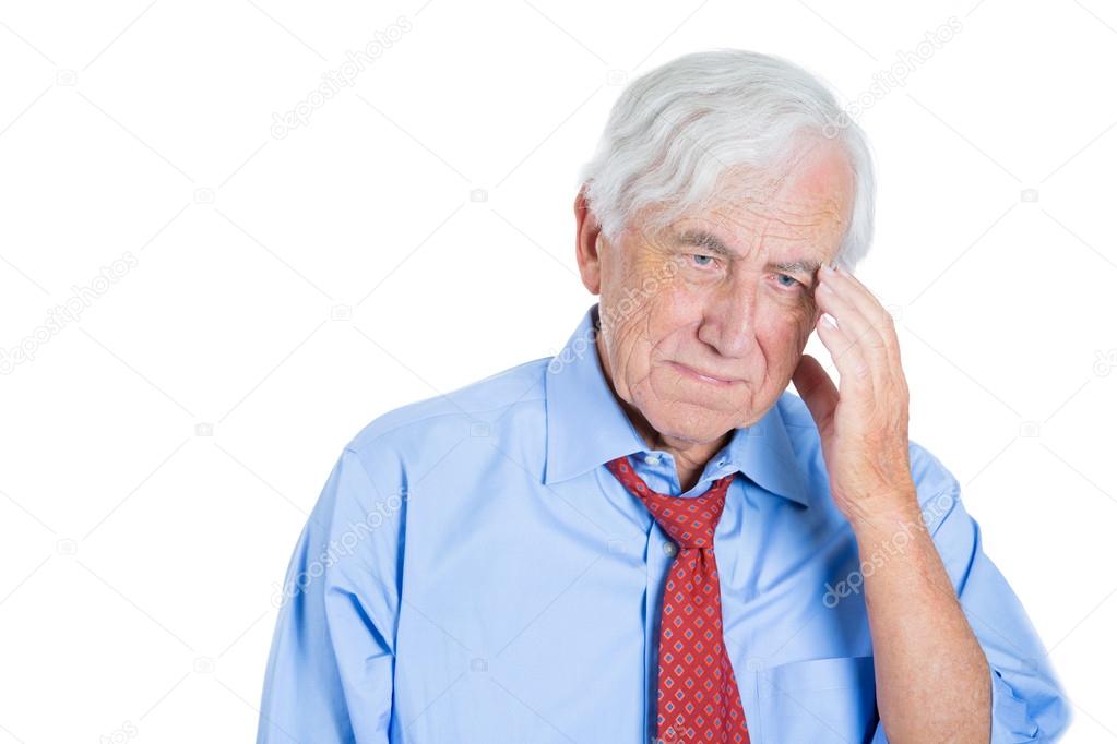 Elderly man really sad and in deep thought