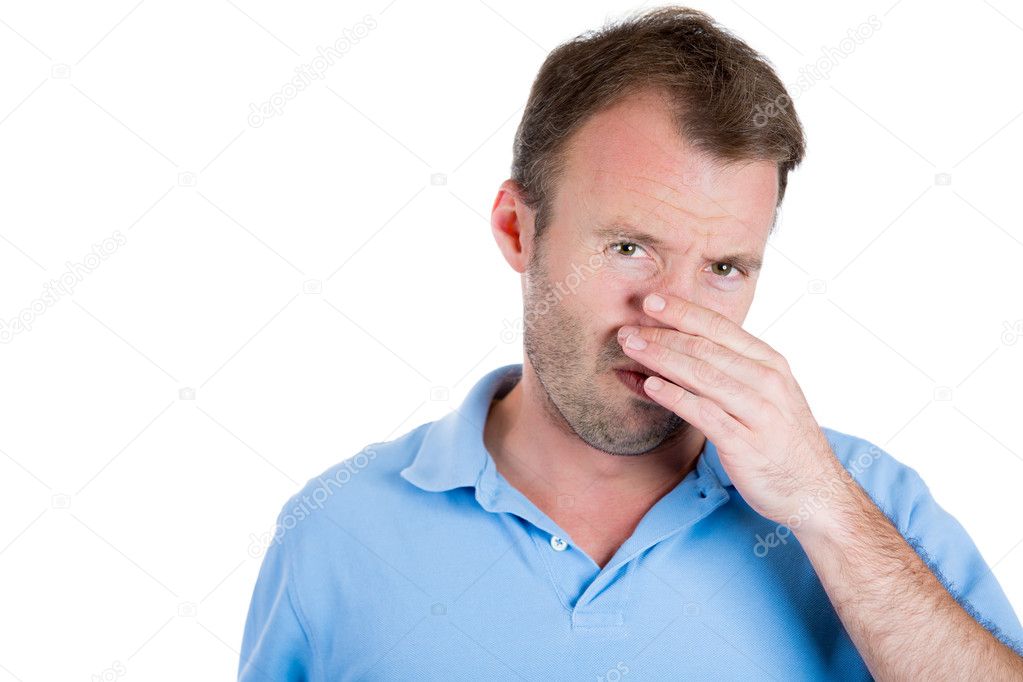 Guy closing nose because something stinks