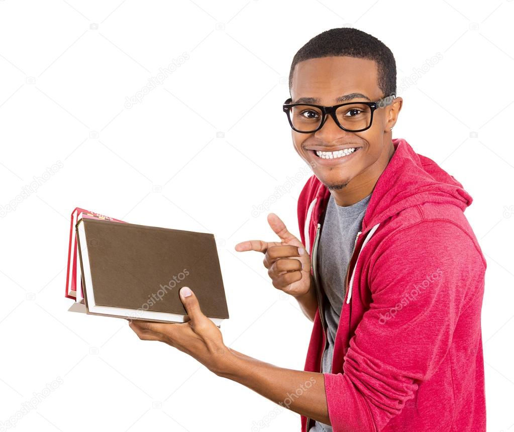Closeup of a young smart handsome man, wearing big glasses, holding books, prepared and ready to ace his exam test finals