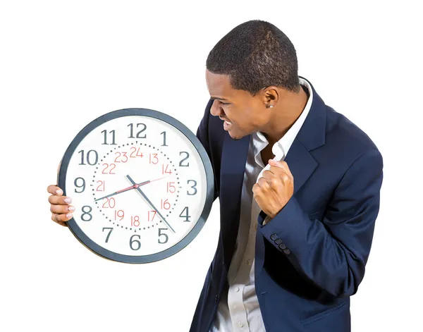 A closeup portrait of a business man, executive, leader holding a clock, very determined, pressured by lack of time, running out of time, late for the meeting — Stock Photo, Image