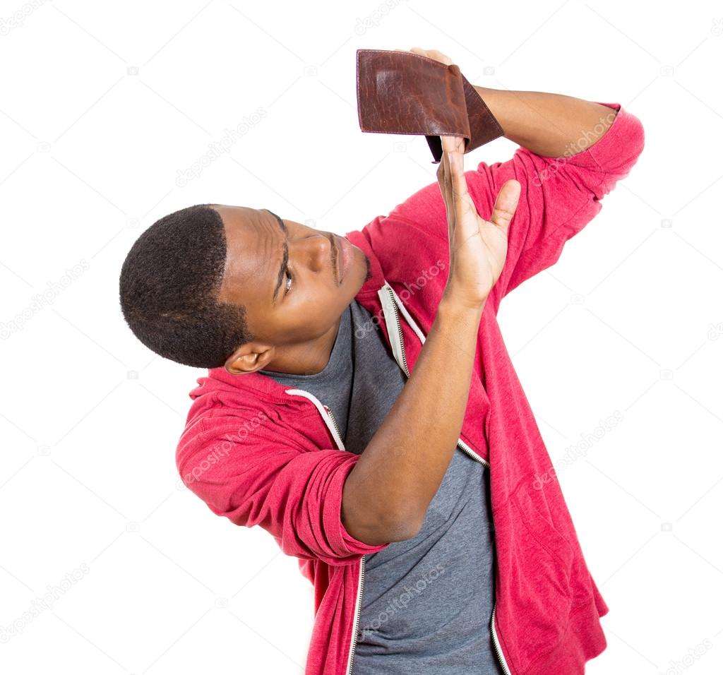 Man looking into empty wallet