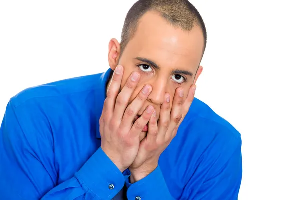 Gestresster Mann mit den Händen im Gesicht Stockbild