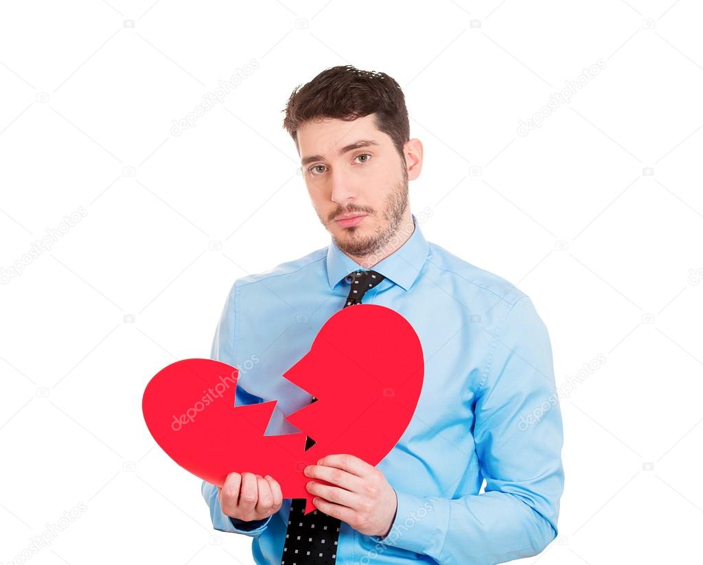 Man holding broken heart