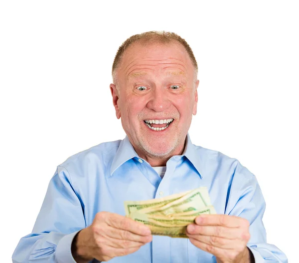 Zralý muž drží peníze dolarové bankovky v ruce — Stock fotografie