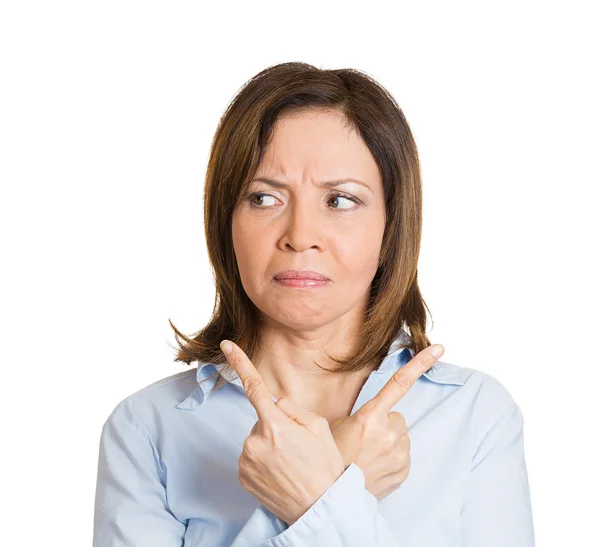 Woman pointing in two different directions — Stock Photo, Image