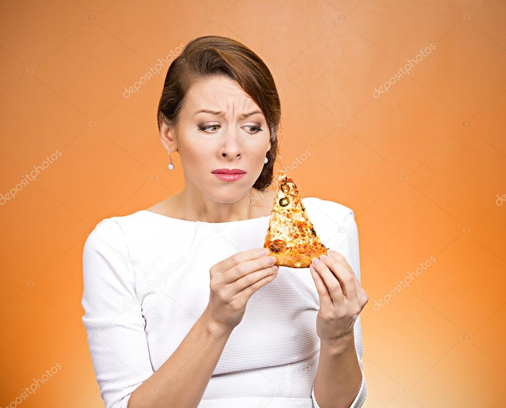 Young woman holding fatty pizza