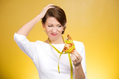 Woman holding pizza with measuring tape around clipart