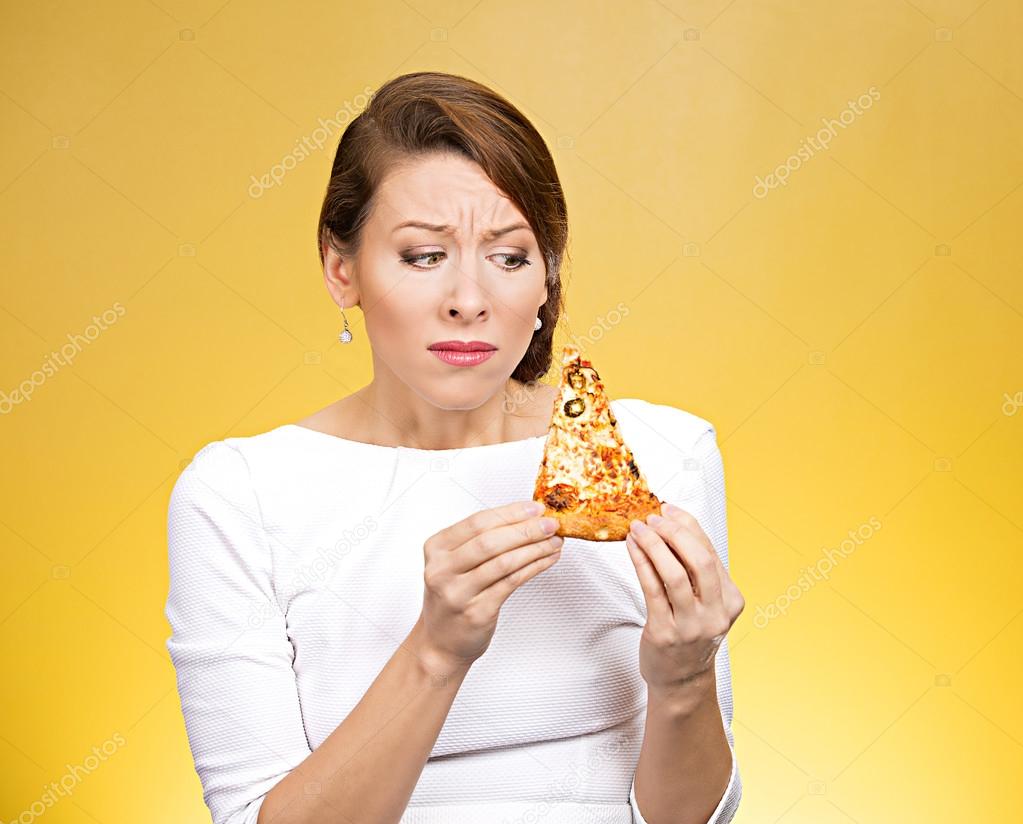 Young woman holding  pizza
