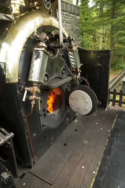 Footplate and open firebox on narrow gauge steam locomotive — Stock Photo, Image