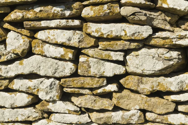 Dry stone limestone wall, small stones, texture, pattern backgro — Stock Photo, Image