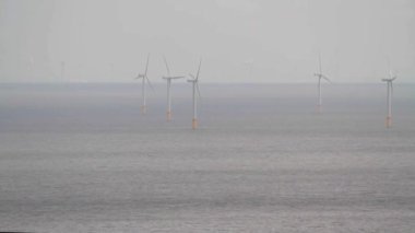 Video, five Wind turbines at sea from Llandudno, North Wales, UK.    