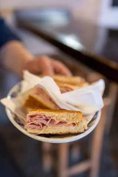 Grilled ham and cheese sandwich in a bar — Stock Photo, Image