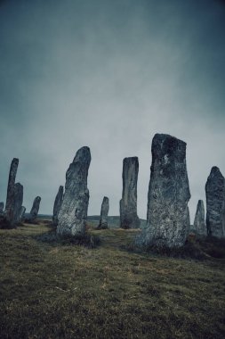 Ancient magic in the Calanais Standing Stones Circle, erected by neolithic men for worship. Celtic traditions in the outer hebrides of Scotland. Touristic attraction.