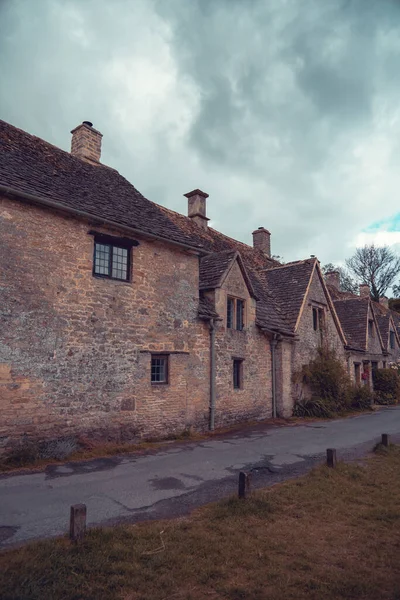 Bibury, UK, 28 june 2022. Charming cottages in Arlington Row in Bibury with River Coln, Cotswolds, Gloucestershire, UK. Moody weather, british summer atmosphere.