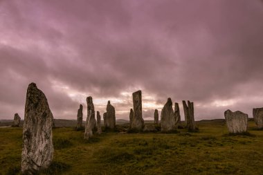 Ancient magic in the Calanais Standing Stones Circle, erected by neolithic men for worship. Celtic traditions in the outer hebrides of Scotland. Touristic attraction.