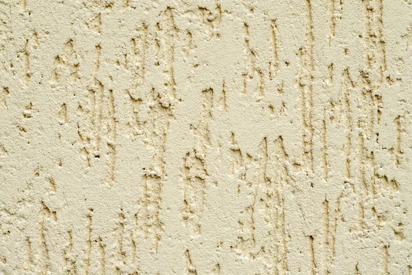 Tessitura della parete intonacata beige. Superficie senza soluzione di continuità e sfondo solido astratto. Pallida struttura muraria dipinta. — Foto Stock