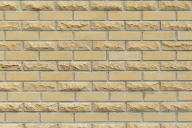 Düzgün tuğlalarla kaplı bej tuğlalar.