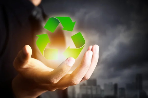 Business people holding recycle sign — Stock Photo, Image