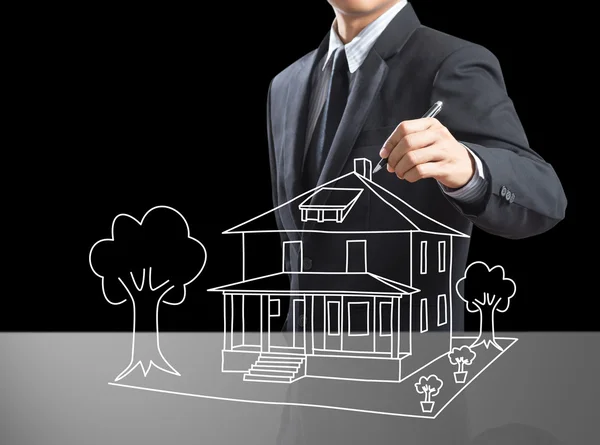 Business man drawing dream house on screen — Stock Photo, Image