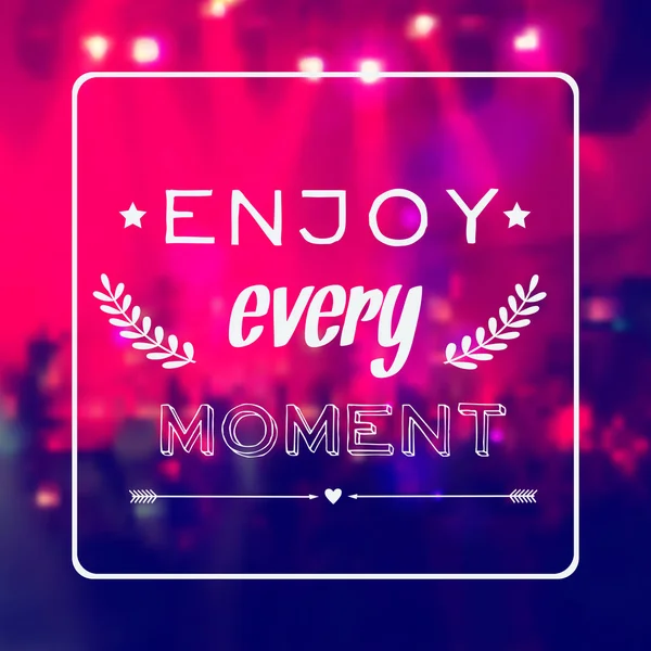 Vector motivational card "Enjoy every moment". Blurred background with rock stage and crowd. — Stock Vector