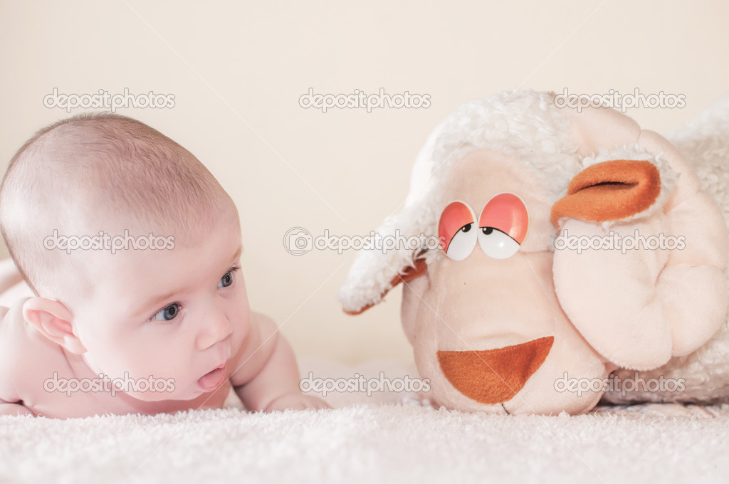 Baby with sheep