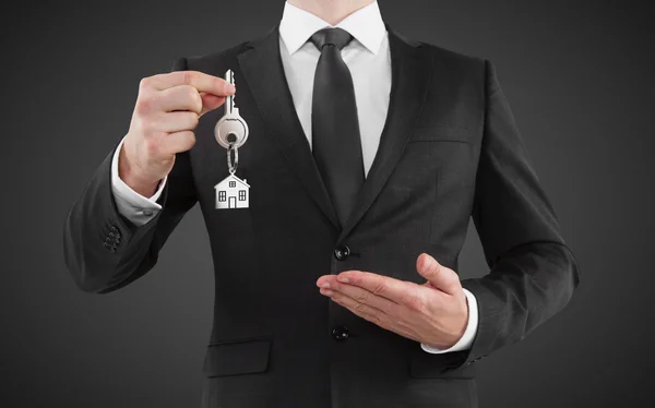 Man gives key — Stock Photo, Image