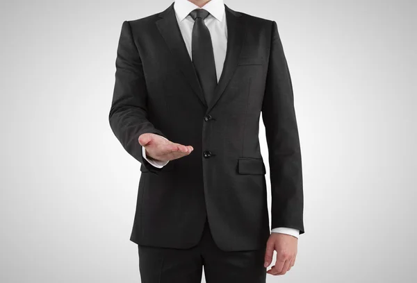 Man in suit showing something — Stock Photo, Image