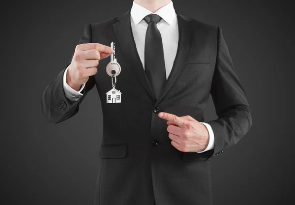 Businessman giving a key — Stock Photo, Image