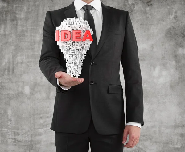 Businessman holding a idea — Stock Photo, Image